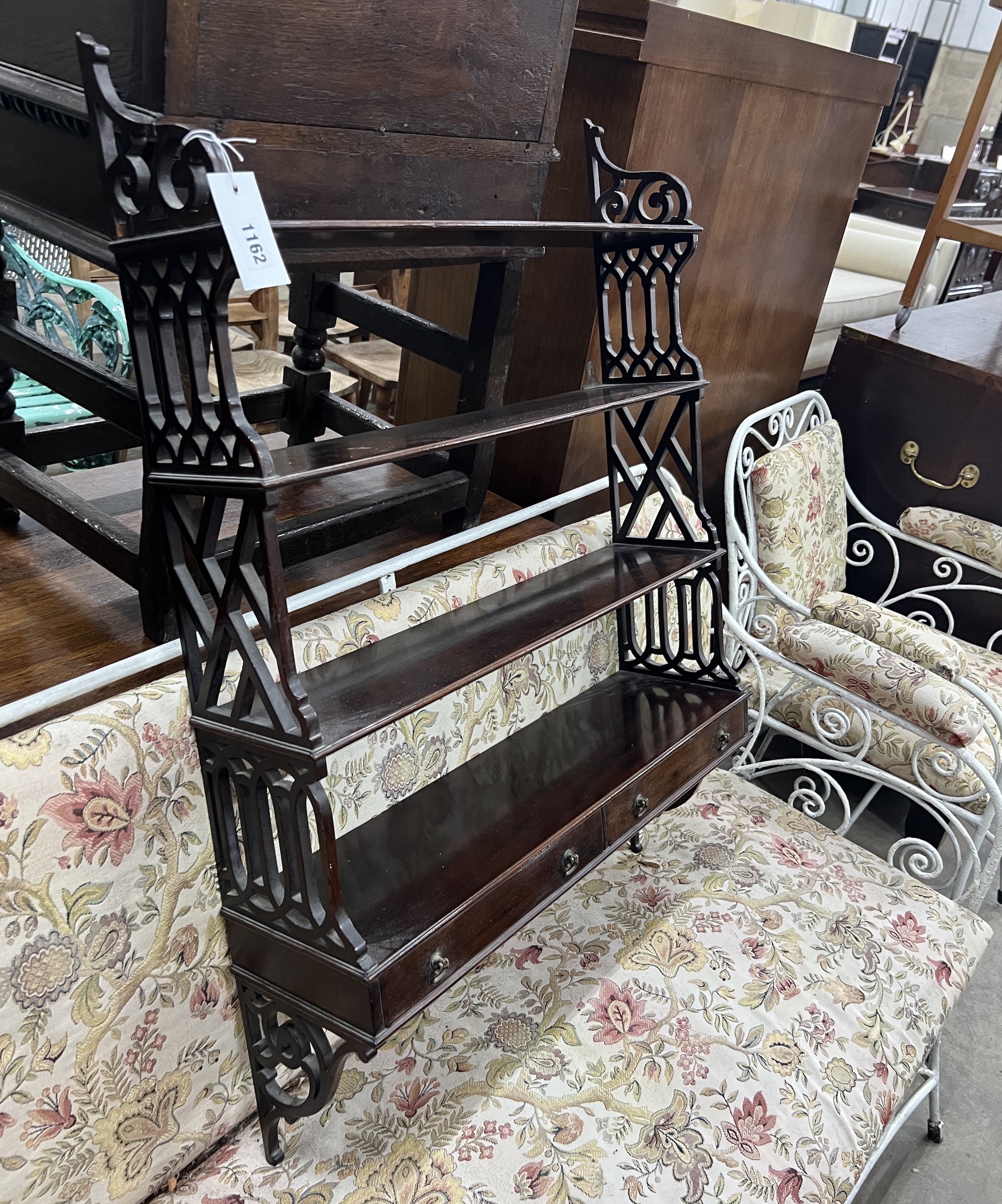 A reproduction George III style mahogany fretwork wall bracket, width 62cm, depth 17cm, height 88cm